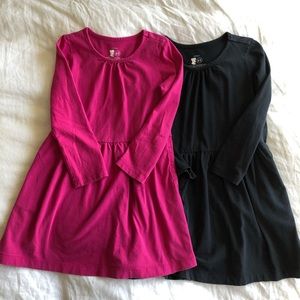 Two Primary long sleeve play dresses, size 4-5